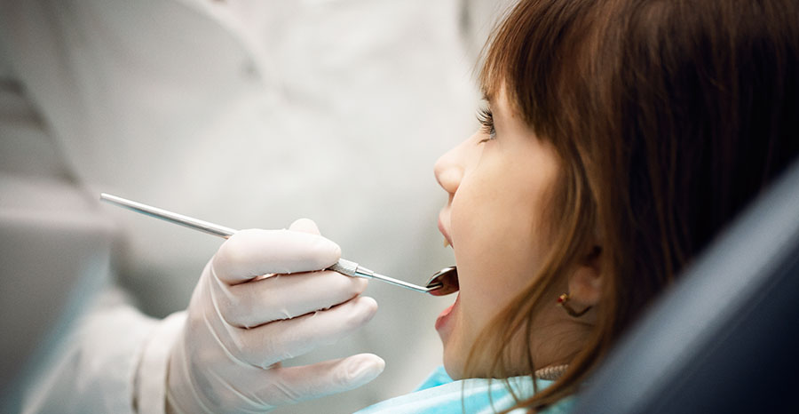 A girl on a regular dental check up