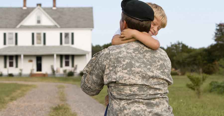 Soldier hugging son